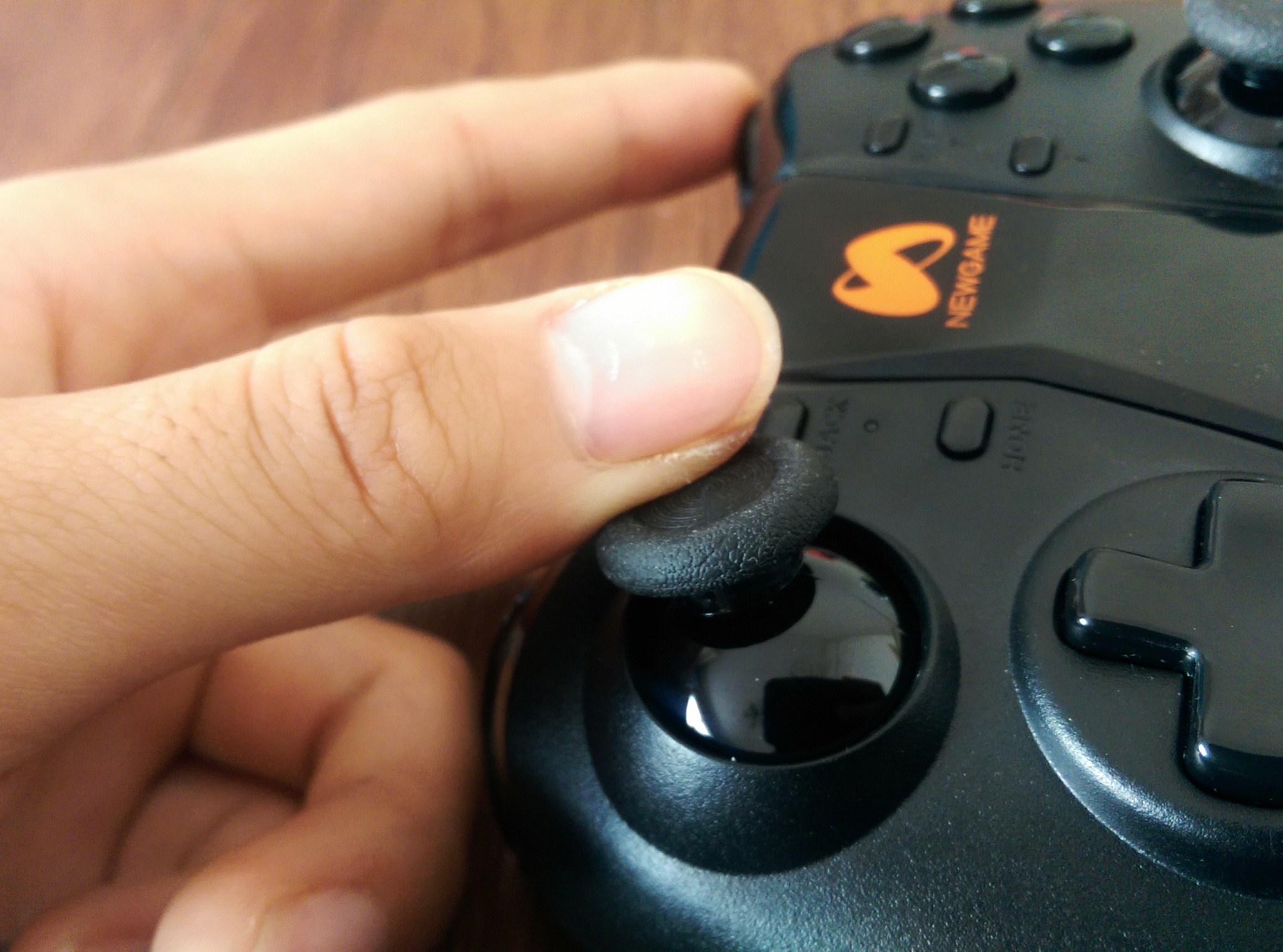 q1游戏手柄怎么样,新游智能游戏手柄q1pro