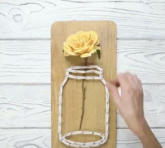 用绳子做绕线画,一根线吊起来拴着笔画画